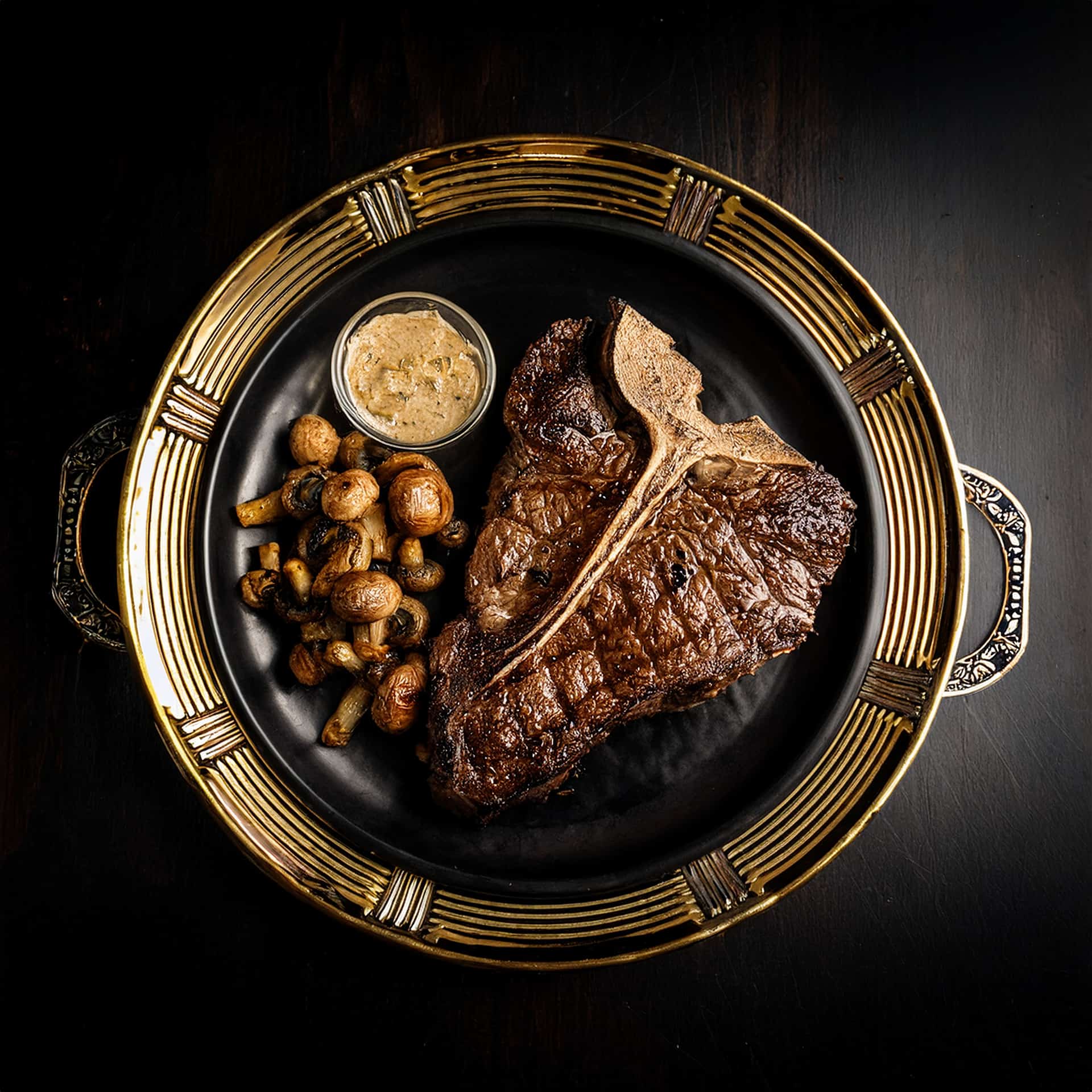 T-Bone Steak With Caramelized Onions and Mushrooms